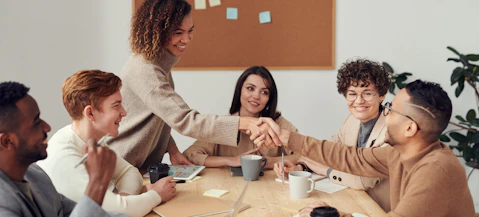 Group of people around a table for good recruitment.