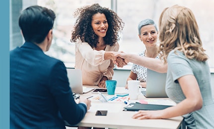 Two people shaking hands over good HR practice