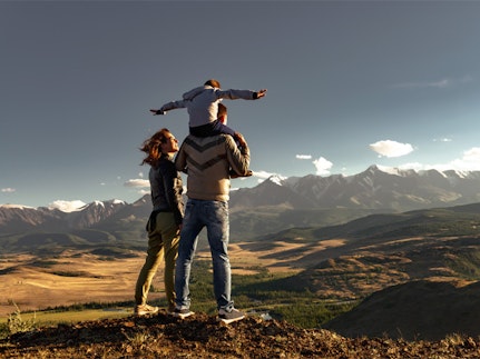 Family looking at mountains deciding on short-term programme