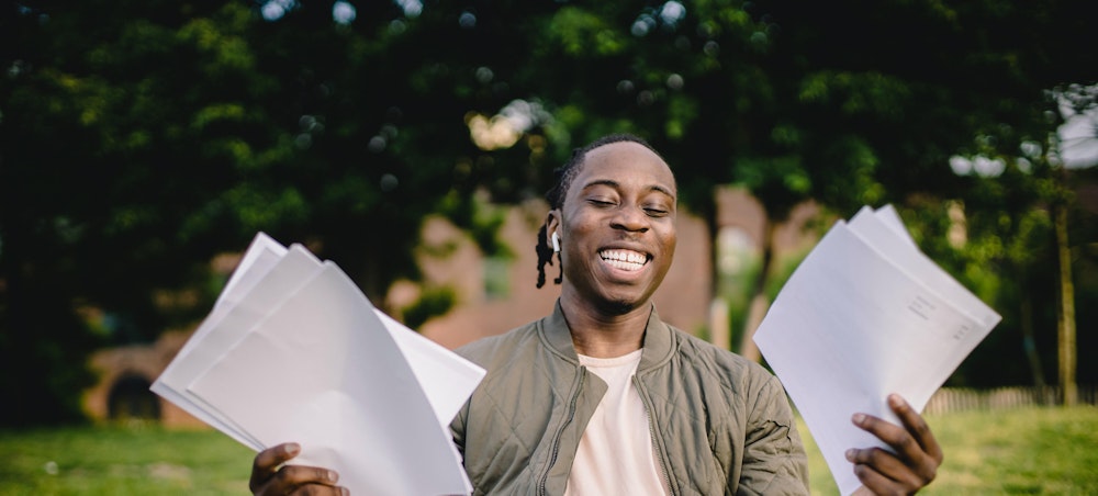 Lady holding papers in preparation for an interview